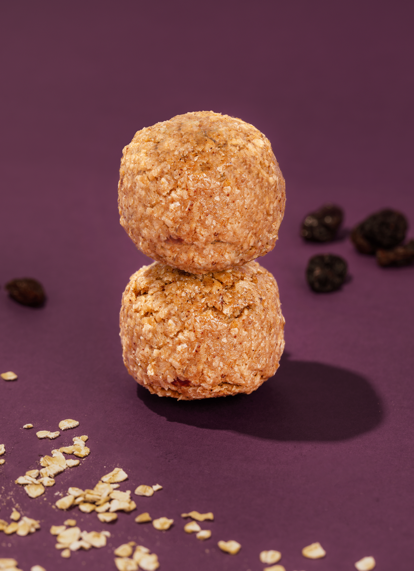 Probites Oatmeal Raisin — stacked bites with scattered oats