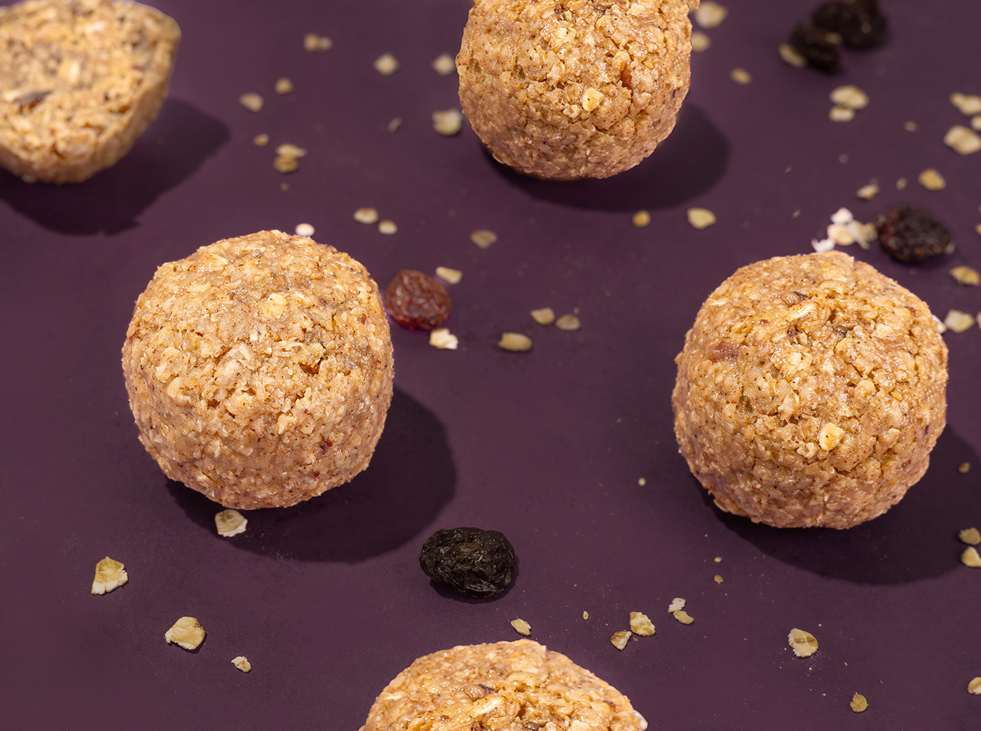 Probites Oatmeal Raisin — flatlay with scattered raisins and oats